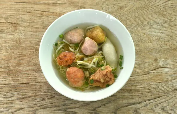 stock image boiled Hakka meatball made from chop pork stuffing fried tofu with bean sprout and lettuce in soup on bowl