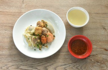 dry steamed Hakka meatball made from chop pork stuffing fried tofu with bean sprout on plate dipping chili sauce and soup clipart