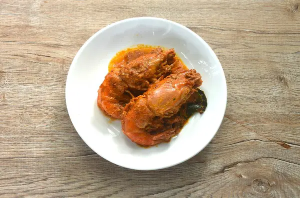 stock image spicy stir fried river shrimp with slice grass leaf curry on plate  