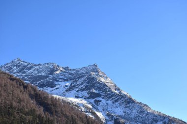 Four Girls Mountain or Siguniangshan as know as Switzerland travel location of China with sky background clipart