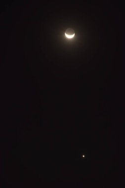 half moon and Venus arranging on sky in night 