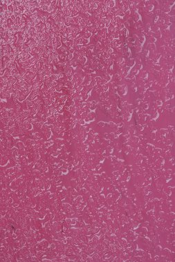 Water drop on pink substrateSelective focus.