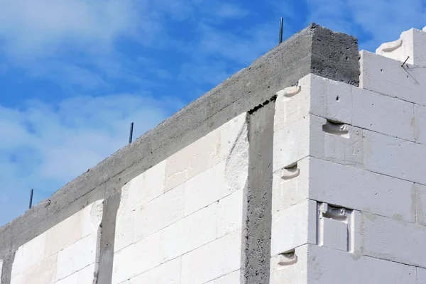 Stock image A reinforced concrete beam and reinforced concrete columns,  walls made of autoclaved aerated concrete blocks, blue sky in the background