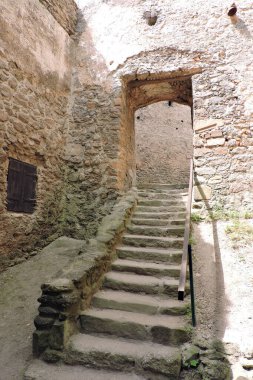 Medieval Chojnik Castle arch windows and door, stone stairs and walls, Sobieszow, the Karkonosze National Park, Poland