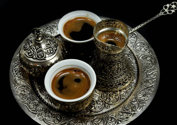 stock image Coffee beans and a cup of brewed coffee, a set for drinking coffee in an oriental style