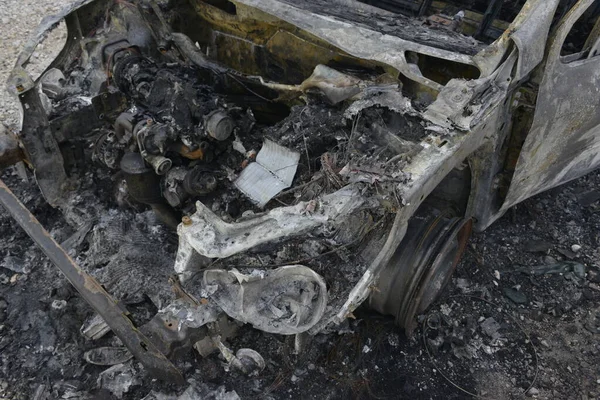 stock image Burned car on the parking place by the road, after the car crash