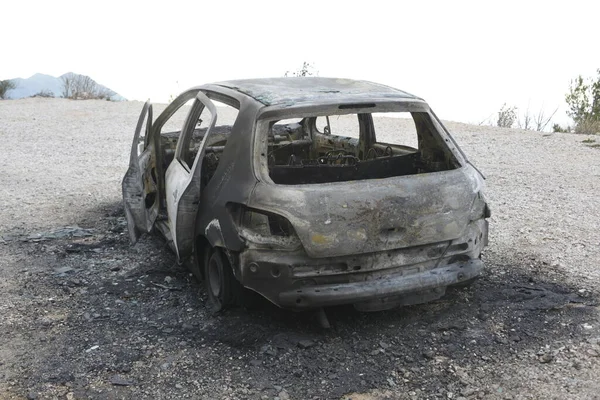 stock image Burned car on the parking place by the road, after the car crash