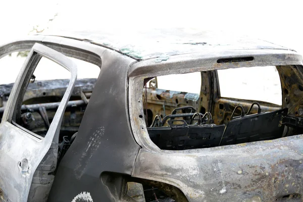 stock image Burned car on the parking place by the road, after the car crash