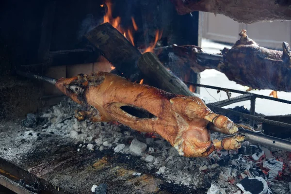 stock image Almost ready roasted pork on the barbecue