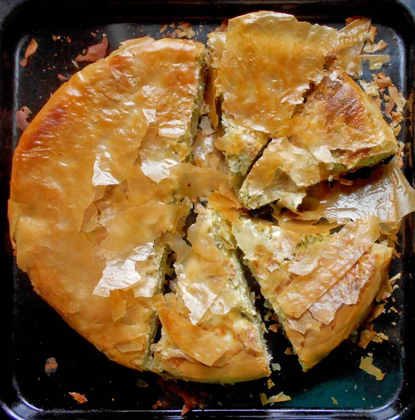 pie with cheese and green, leafy vegetables, chard or spinach