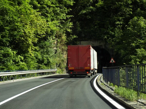 Heavy trucks on a mountain road