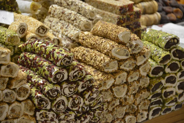 Various rolls of Turkish delights on the market stall in the street market in Istanbul
