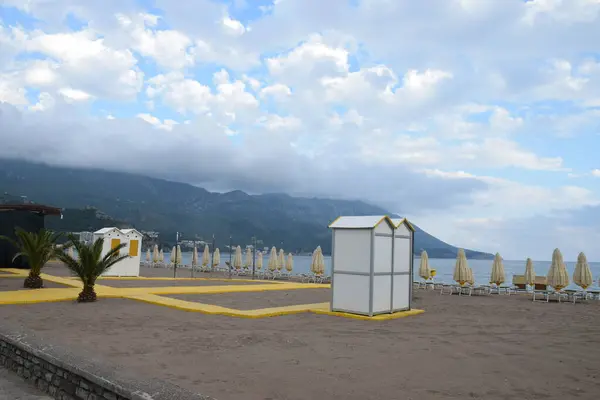 stock image Beach equipment: boardwalk, showers, mobile toilets, umbrellas and deckchairs