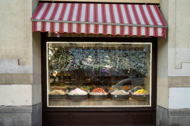 Budapest, Hungary - November 25th, 2022: A colorful display in a sweet shop window on a Budapest, Hungary, street clipart