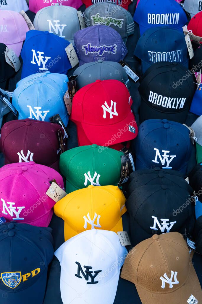 New York, USA - July 23rd, 2023:A variety of colors and designs of New York baseball caps for sale.