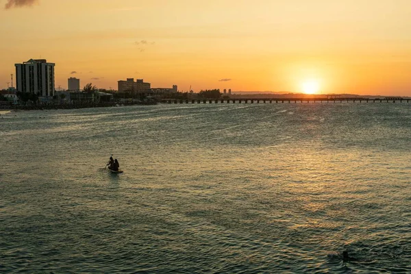 stock image two people canoeing in the sunset of Fortaleza Ceara north of Brazil