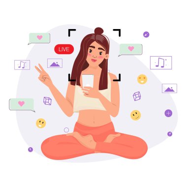 Sosyal Medya Canlı Oturumu. Nilüfer pozisyonunda oturan ve elinde akıllı bir telefon tutan genç bir kadın barış işareti yapıyor..