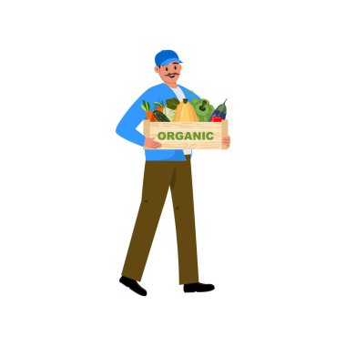 Mavi takım elbiseli mutlu adam elinde balkabağı ve kabak gibi taze sebzelerle dolu bir kutu tutuyor.