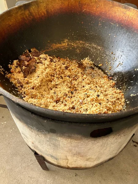 stock image Large pot of Plov, a popular, traditional Uzbek dish based on rice. High quality photo