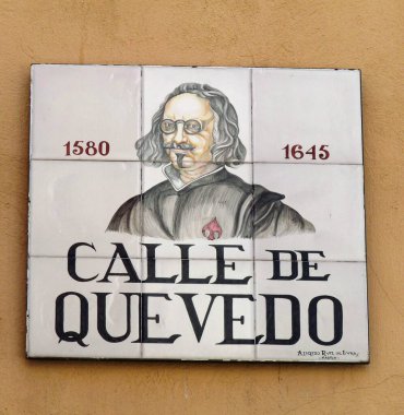 Plaque on central Madrid street named after Spanish Golden Age writer and poet Francisco de Quevedo, showing his portrait and date of birth and death