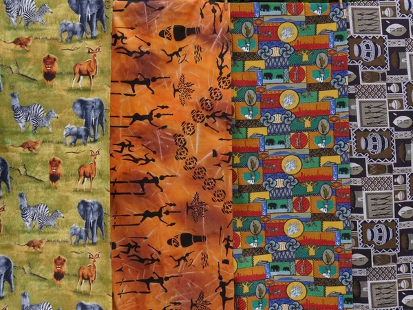 Close up of cloths with African patterns on sale on stall, South Africa. High quality photo