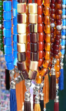 Close up of colourful, sparkling, traditional Greek worry beads. High quality photo clipart