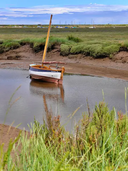 stock image Boat in shallow water, Blakeney, North Norfolk coast, East Anglia, UK. High quality photo