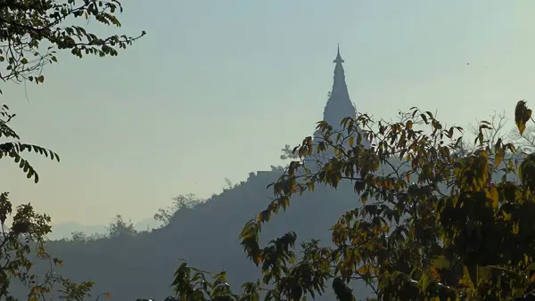 beautiful landscape with a tree and a mountain in the mrauk-u