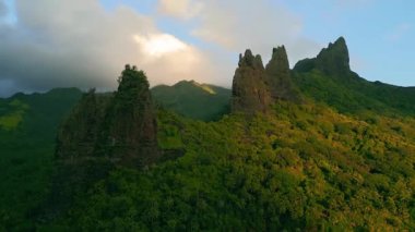 the beautiful sunset view of the moai mountains on the island ua huka french polynesia