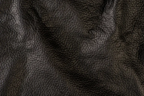 黒革の質感 黒本革のクローズアップ 折り目とバンプのレザートップビュー — ストック写真