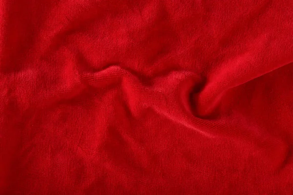 Red velvet texture for postcard or background for design. Red background for Christmas theme or Valentines day, high quality, large format. Abstract texture of draped red velvet.