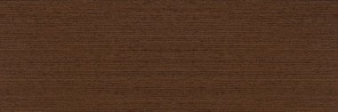 Texture of wenge wood. Dark brown wood for furniture or flooring. Close-up of a Wenge wooden plank, top view