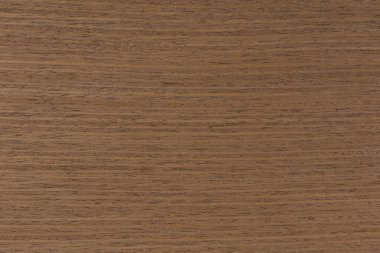 Dark brown walnut wood texture, natural wood pattern for making furniture, parquet or doors. Top view of natural veneer