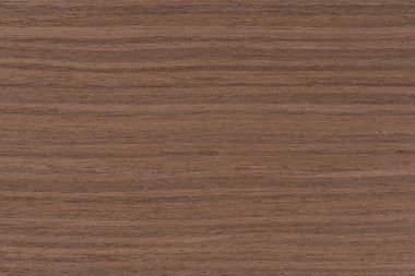 Dark brown walnut wood texture, natural wood pattern for making furniture, parquet or doors. Top view of natural veneer