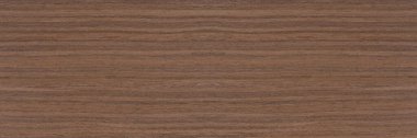 Dark brown walnut wood texture, natural wood pattern for making furniture, parquet or doors. Top view of natural veneer
