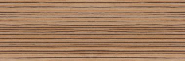 Zebra tree. Texture of brown wood with horizontal black stripes. African zebrano wood texture on macro. Photo in very high resolution