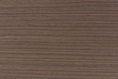 Dark brown walnut wood texture, natural wood pattern for making furniture, parquet or doors. Top view of natural veneer