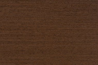 Texture of wenge wood. Dark brown wood for furniture or flooring. Close-up of a Wenge wooden plank, top view