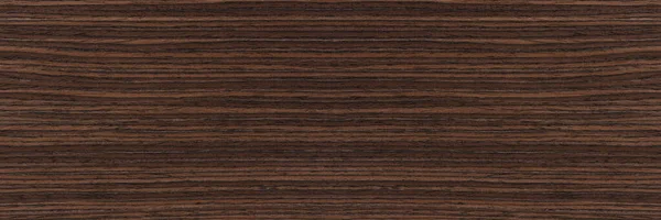 Rosewood texture. Texture of dark mahogany with an intense pattern, natural rosewood veneer for the production of furniture or yacht decoration.