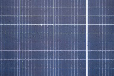 Solar panel texture with raindrops, waterproof solar panel modules, top view, as background or texture.