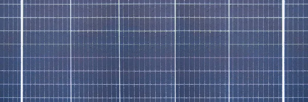 Solar panel texture with raindrops, waterproof solar panel modules, top view, as background or texture.