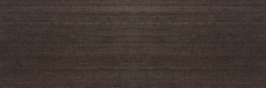 Texture of mahogany. Texture of koto wood with a reddish brown tint. Exotic rare wood from Africa for the production of expensive furniture or interior elements.