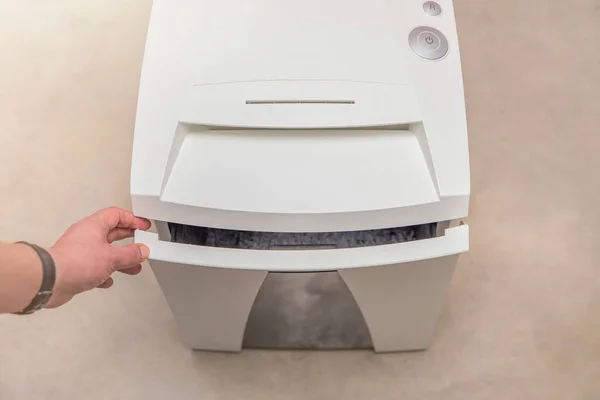 Industrial paper shredder. Paper shredder in the office, use and maintenance of professional office equipment