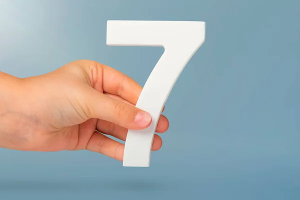 Number Seven Hand Hand Holding White Number Blue Background Copy — Stock Photo, Image