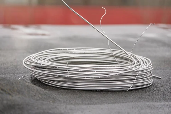Thick aluminum wire for grounding buildings. Grounding wire to protect the building structure from short circuit