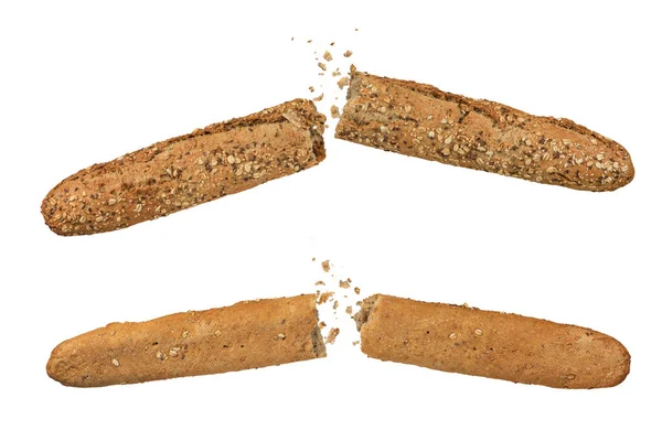全麦黑麦法式面包 一组黑麦面包分成两部分 面包屑在白色孤立的背景上飞向不同的方向 侧视图 从下方看 — 图库照片