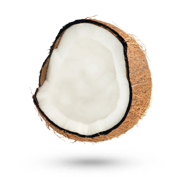 Polovina Kokosu Bílém Izolovaném Pozadí Část Kokosu Otočí Stranu Padá — Stock fotografie