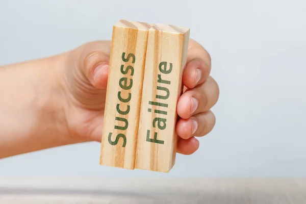 Success Failure Hand Holds Two Wooden Cubes Inscriptions Success Failure Stock Picture