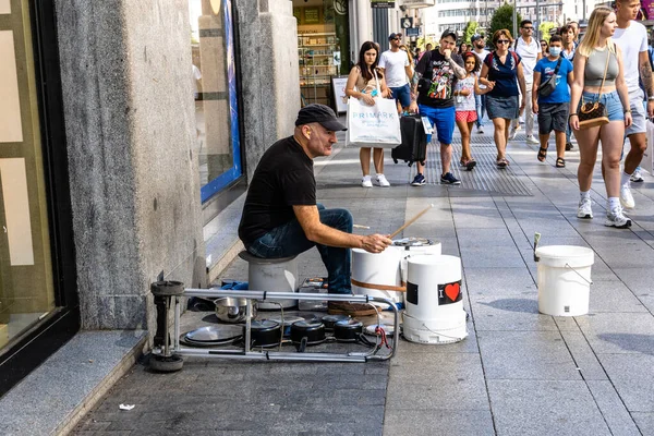 stock image Madrid, Spain - September 17, 2022: Street musician playing drums on plastic buckets and pots and pans