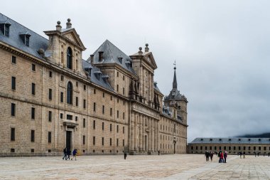 San Lorenzo de El Escorial, Spain - October 25, 2020: Royal Monastery of San Lorenzo de El Escorial near Madrid. Cloudy and foggy winter day